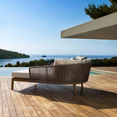 Elegant rattan daybed for outdoor relaxation with plush cushion pillow